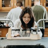 Stuart Hall School Photo #15 - A student getting hands-on in Mr. Snyder's science lab!