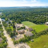 North Yarmouth Academy Photo #12 - An aerial photo of NYA's 20+ acre campus located in the coastal town of Yarmouth, Maine. NYA is 10 minutes from Portland and two hours from Boston. We are a traditional New England prep school with a campus dotted withhistoric brick buildings, a modern science center, playing fields, our own ice arena, and modern dormitory.